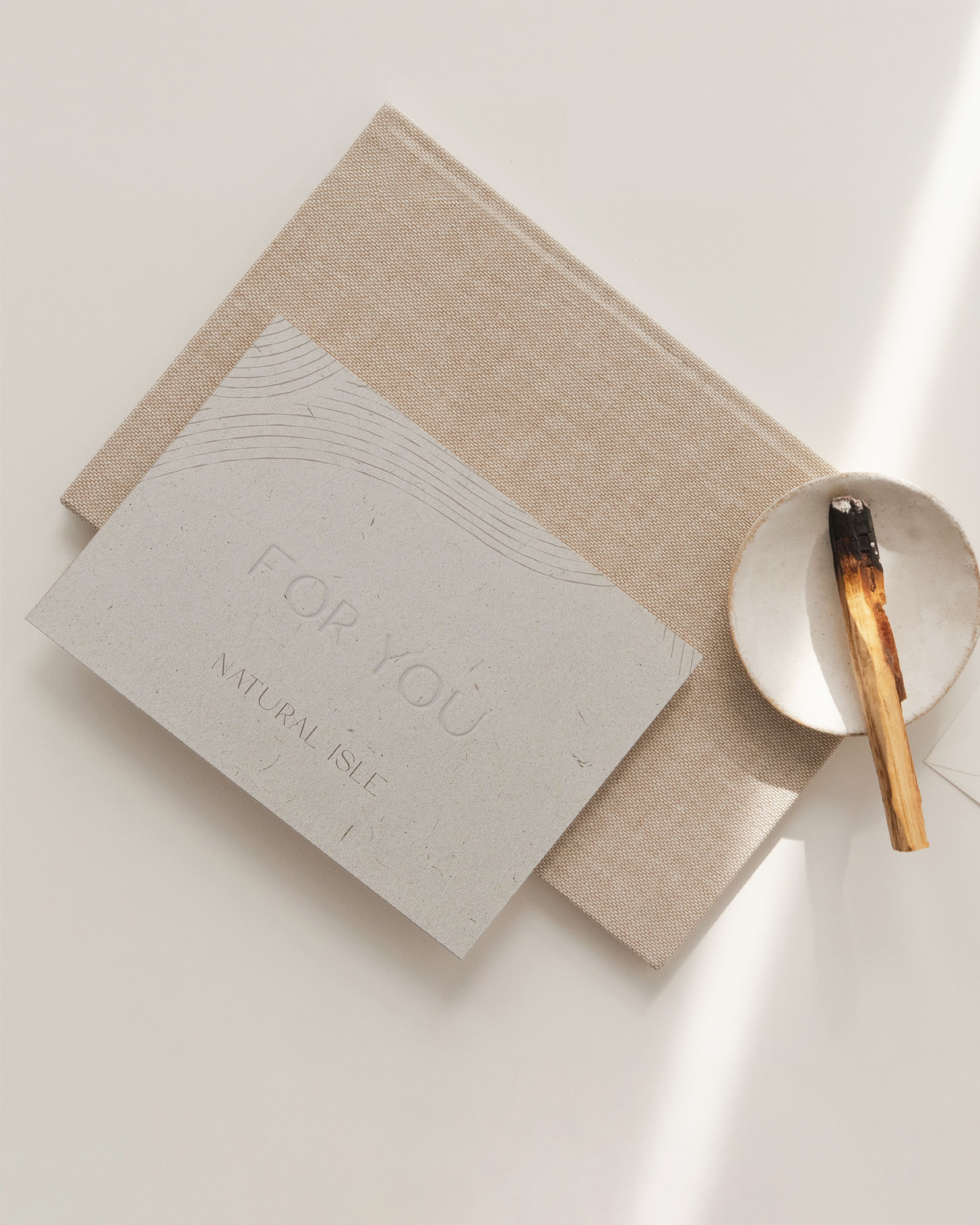 Natural Isle Beige gift card with 'For You' text on a light surface